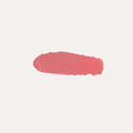 Close-up of buildable cream blush compact with a soft rosy swatch on fair skin showing a dewy, natural flush