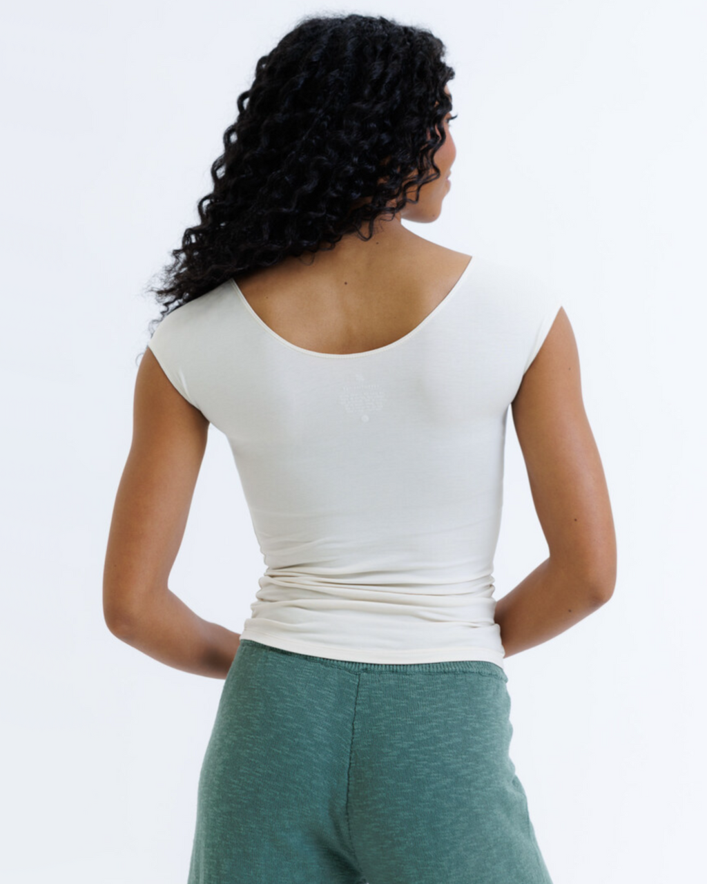 Women's fitted tri-blend essential tee with scoop neckline and cap sleeves, shown as a flat lay