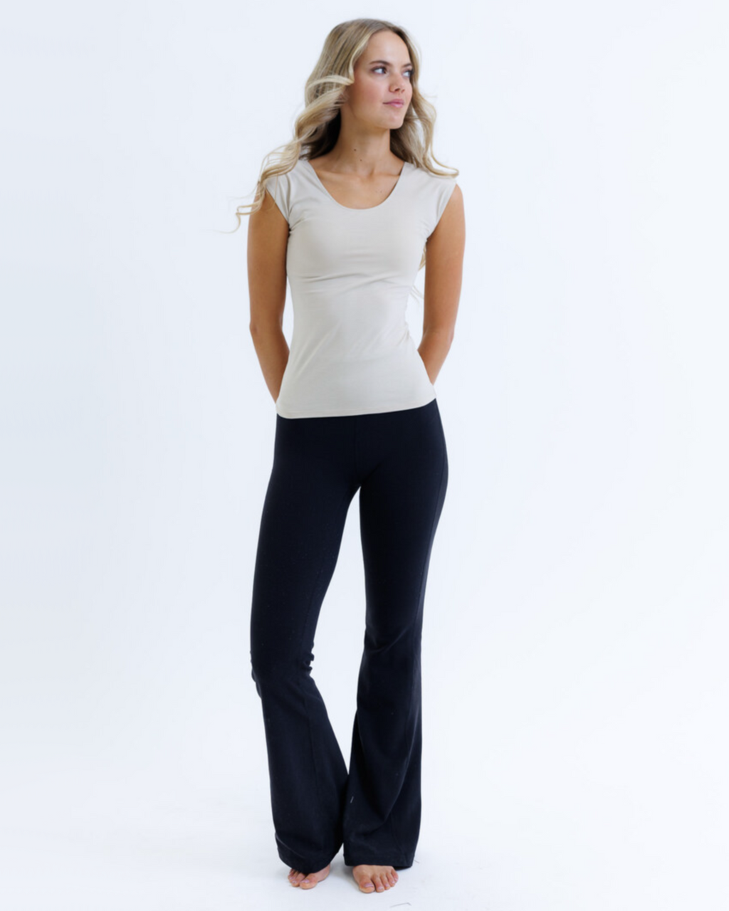 Women's fitted tri-blend essential tee with scoop neckline and cap sleeves, shown as a flat lay