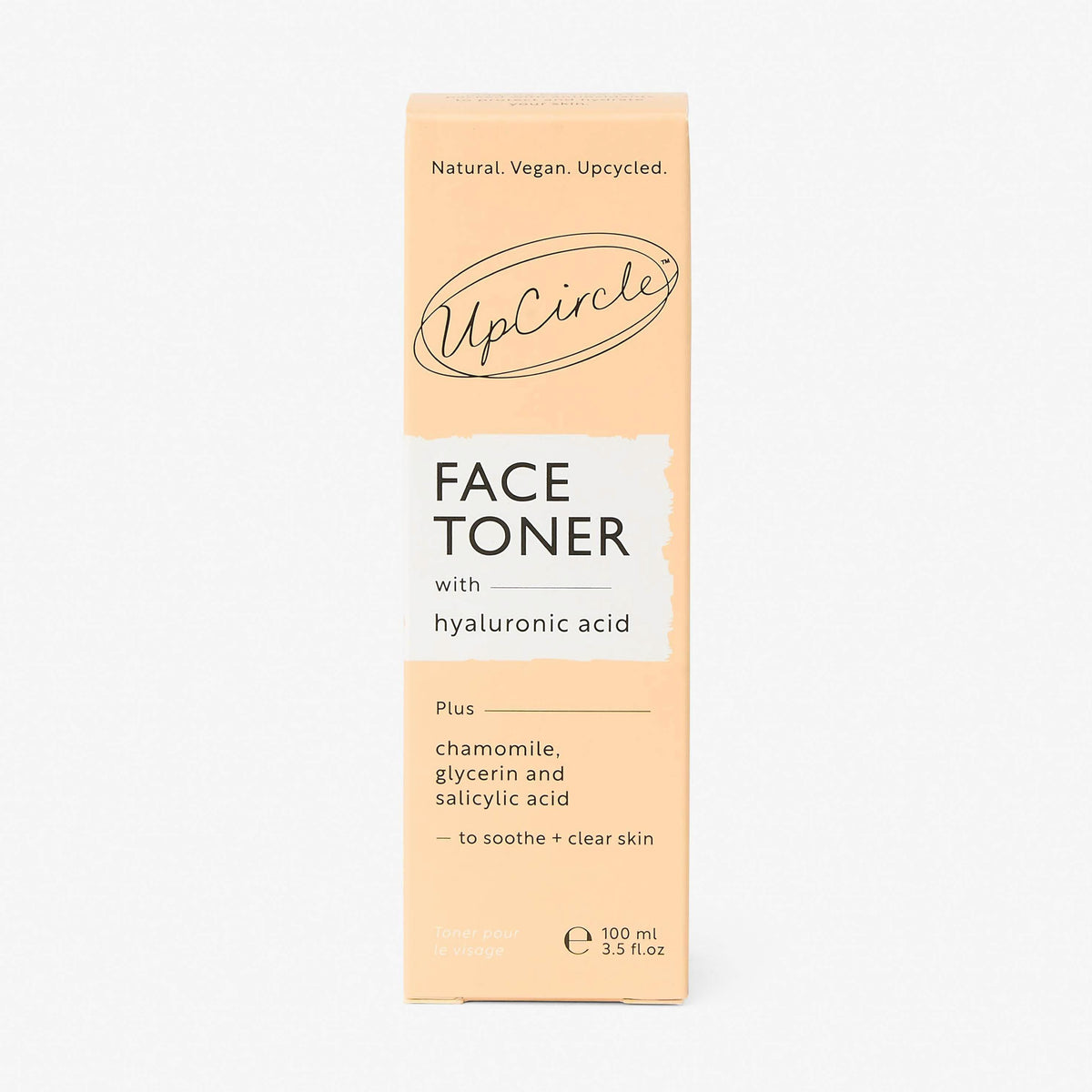 UpCircle Hyaluronic Acid and Chamomile Face Toner in a glass spray bottle with cardboard packaging on a clean surface