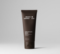 Close-up of hair styling paste jar with matte finish lid on a clean grooming surface