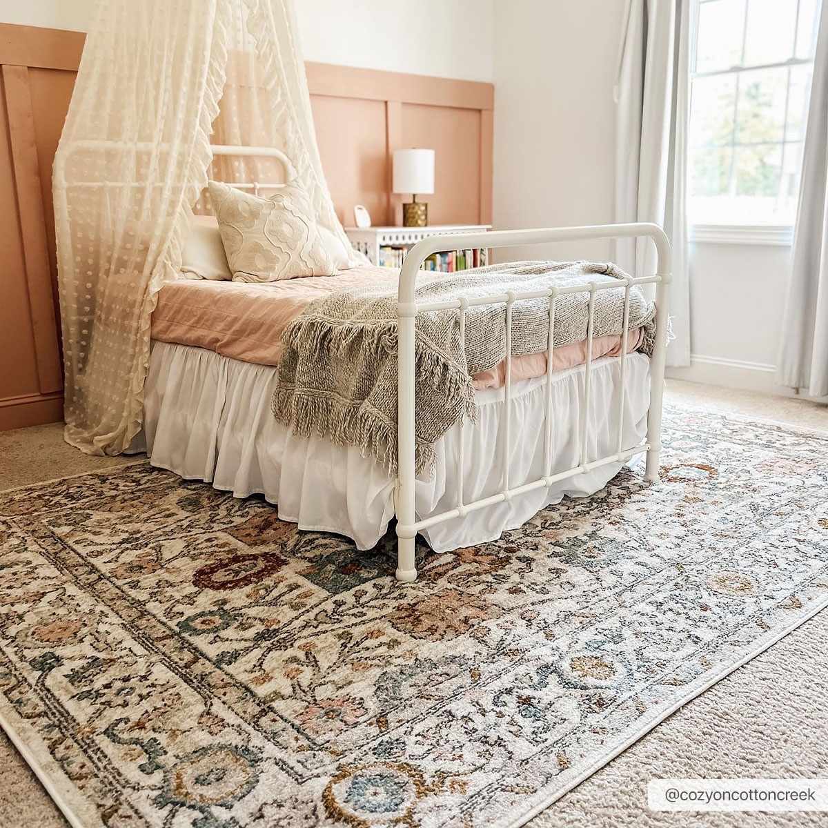 Herstmonceux traditional area rug with vintage pattern in charcoal, mustard, dusty pink, and off-white tones on a medium pile
