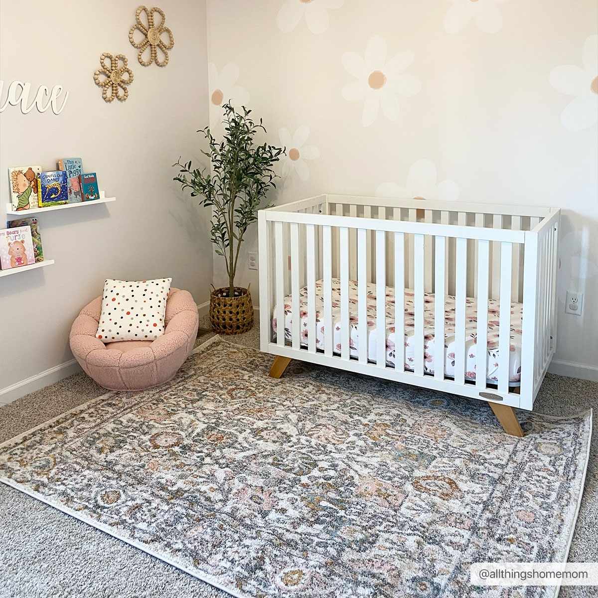 Herstmonceux traditional area rug with vintage pattern in charcoal, mustard, dusty pink, and off-white tones on a medium pile