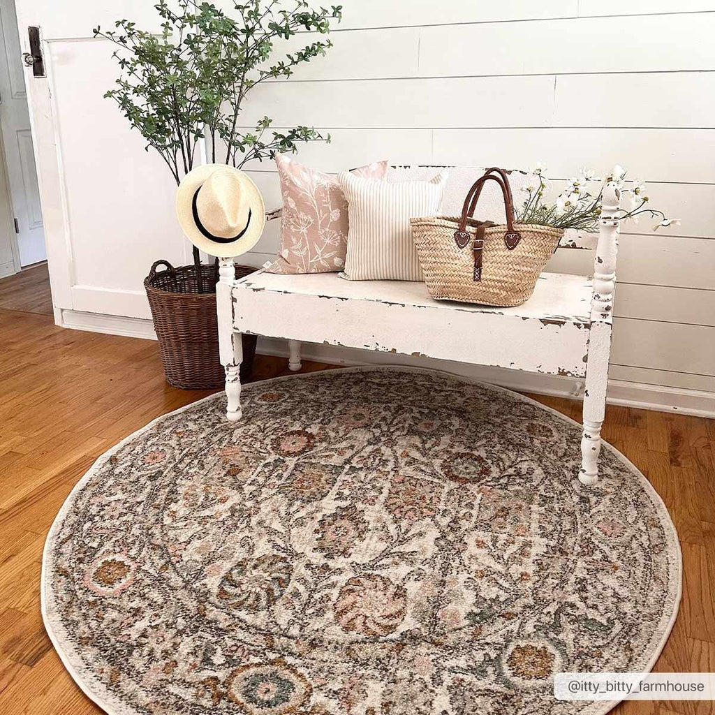 Herstmonceux traditional area rug with vintage pattern in charcoal, mustard, dusty pink, and off-white tones on a medium pile