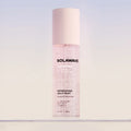 Solawave Solabiome Refreshing Jelly Mist bottle being spritzed onto clear skin, ultra-light probiotic face toner