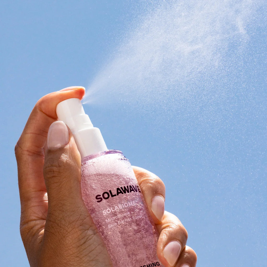Solawave Solabiome Refreshing Jelly Mist bottle being spritzed onto clear skin, ultra-light probiotic face toner