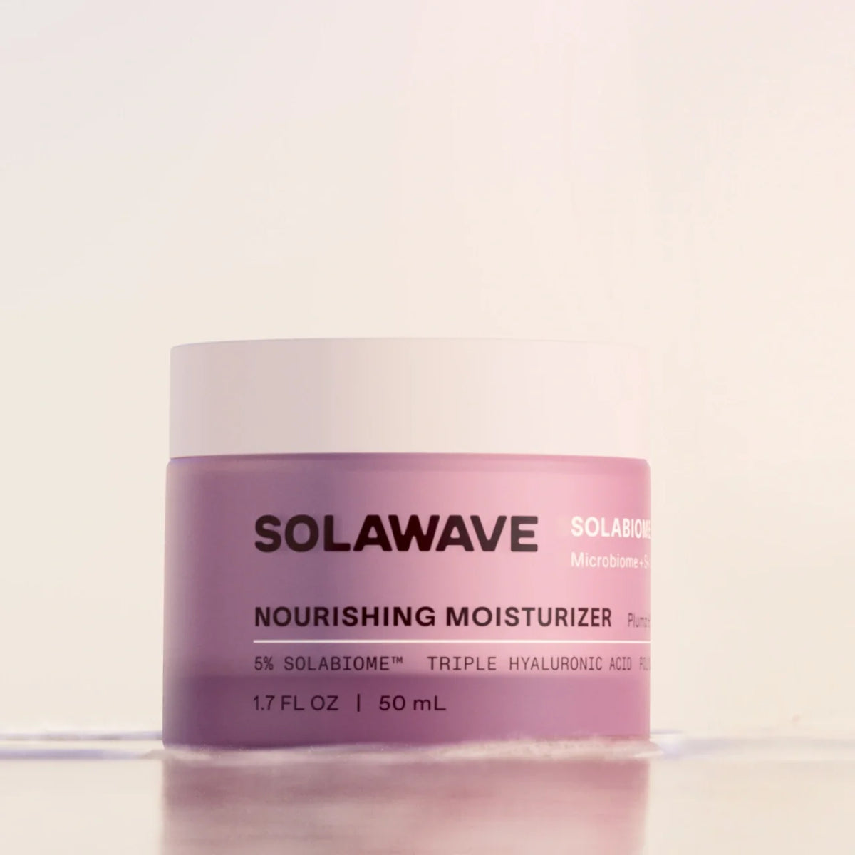 Solawave Solabiome Nourishing Moisturizer jar with clean white packaging on a minimal surface