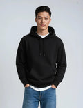 Heavyweight cotton fleece pullover hoodie in a structured standard fit, shown in a neutral colorway with ribbed cuffs and waistband