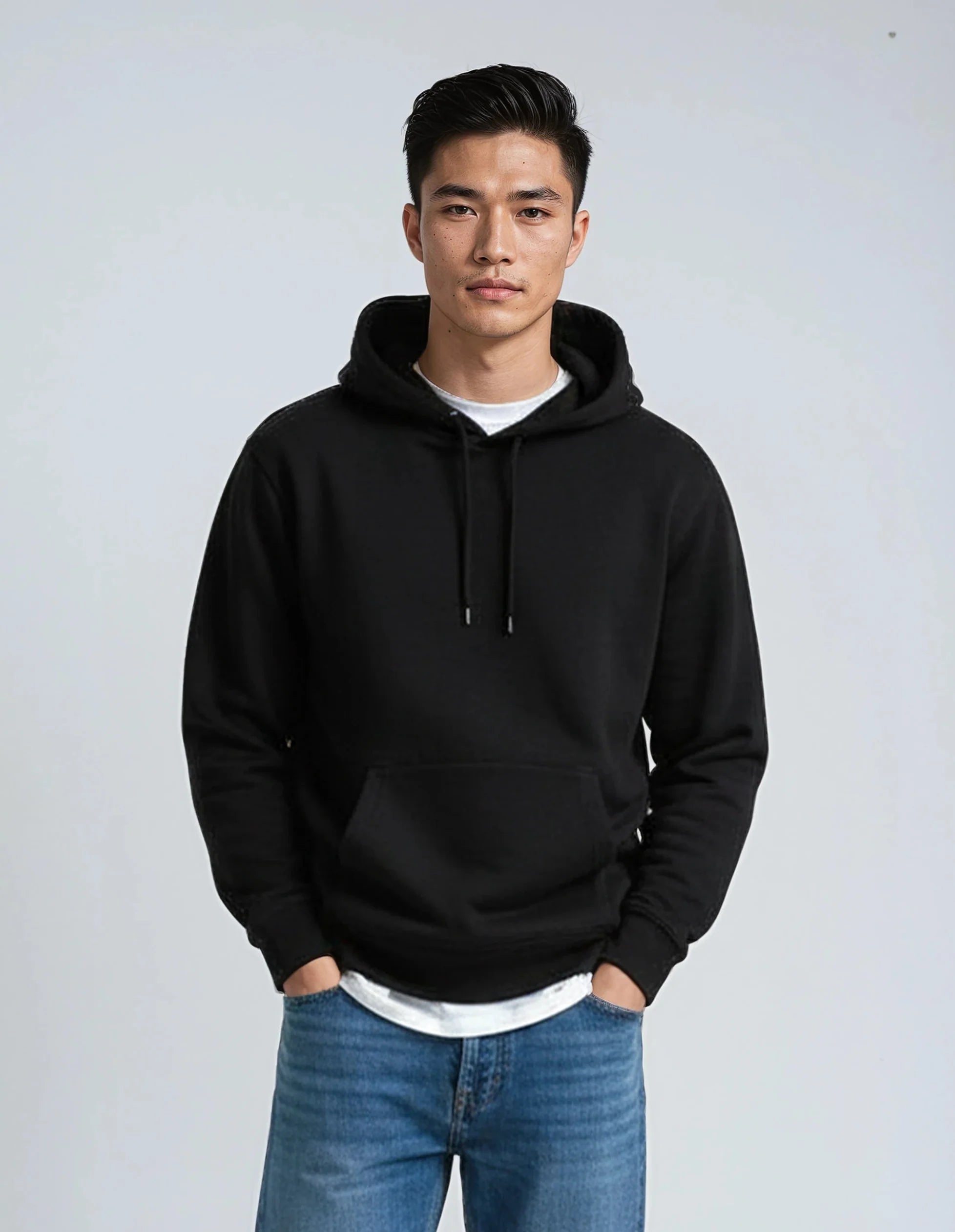 Heavyweight cotton fleece pullover hoodie in a structured standard fit, shown in a neutral colorway with ribbed cuffs and waistband