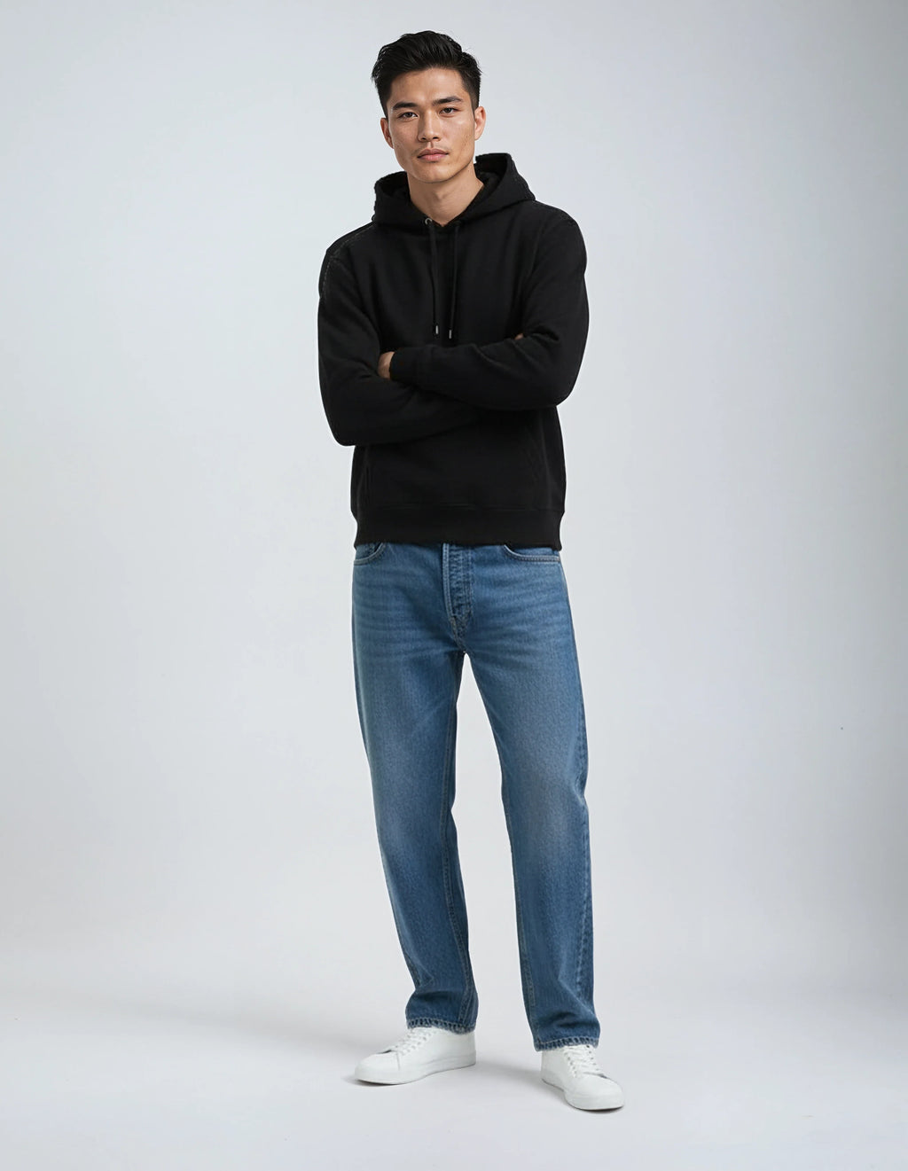 Heavyweight cotton fleece pullover hoodie in a structured standard fit, shown in a neutral colorway with ribbed cuffs and waistband