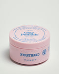 Firsthand Supply Clay Pomade 3 oz jar on a clean surface, matte finish lid with minimalist label