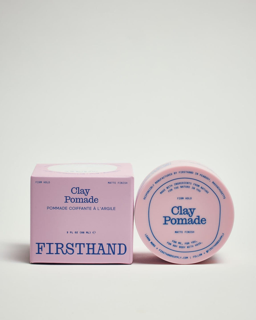 Firsthand Supply Clay Pomade 3 oz jar on a clean surface, matte finish lid with minimalist label