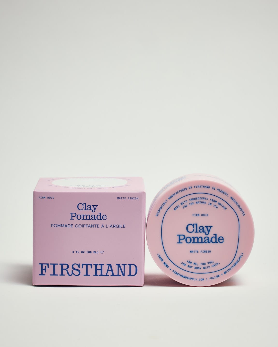 Firsthand Supply Clay Pomade 3 oz jar on a clean surface, matte finish lid with minimalist label