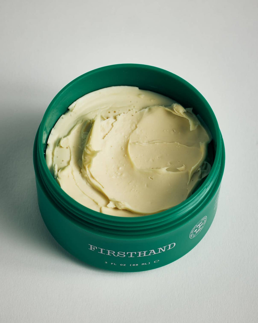 Firsthand Supply All-Purpose Pomade 3 oz jar on a neutral surface, low-shine strong-hold hair pomade