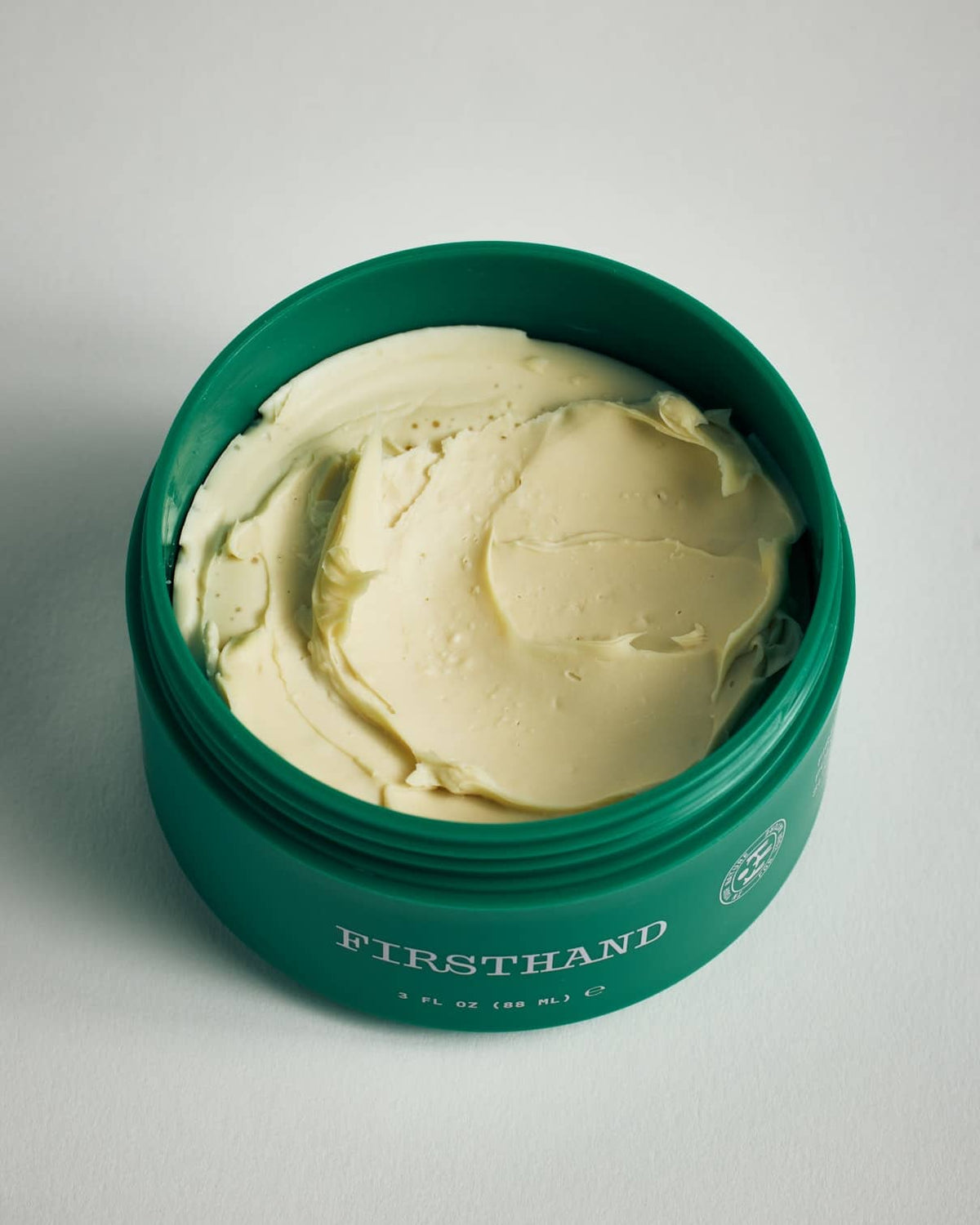 Firsthand Supply All-Purpose Pomade 3 oz jar on a neutral surface, low-shine strong-hold hair pomade