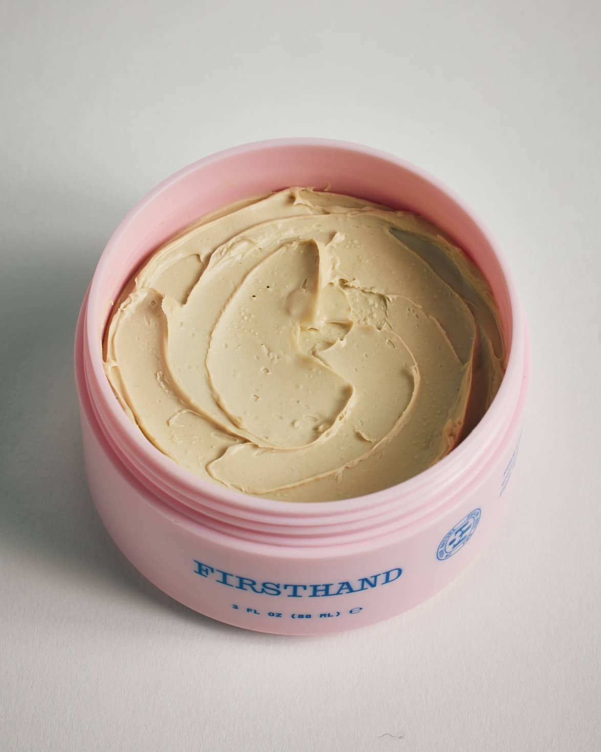 Firsthand Supply Clay Pomade 3 oz jar on a clean surface, matte finish lid with minimalist label