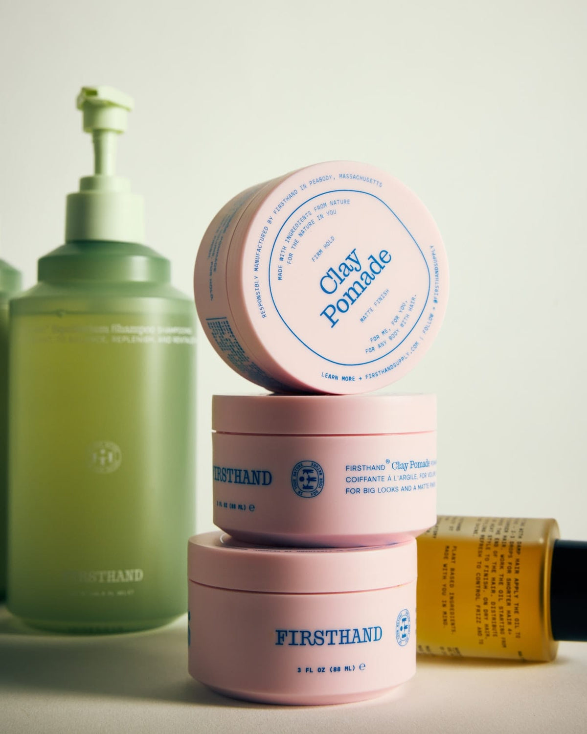 Firsthand Supply Clay Pomade 3 oz jar on a clean surface, matte finish lid with minimalist label