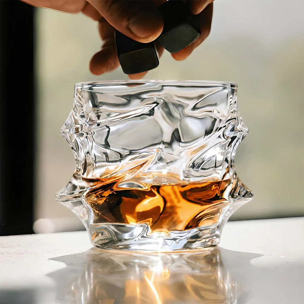 Handcrafted Storm Crystal Whisky Glass with textured exterior and smooth interior, filled with amber whisky