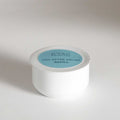 Day After dry shampoo brush refill powder canister in neutral packaging against a clean white background