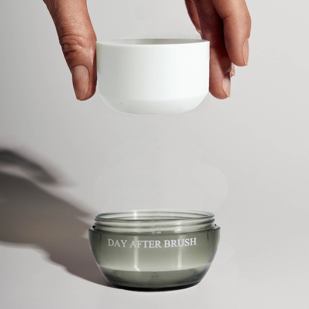 Day After dry shampoo brush refill powder canister in neutral packaging against a clean white background