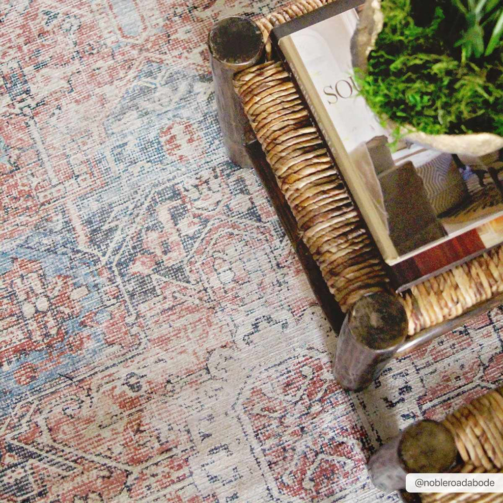 Rosman distressed flat weave area rug in warm red, blue, and earthy tones with vintage-inspired pattern