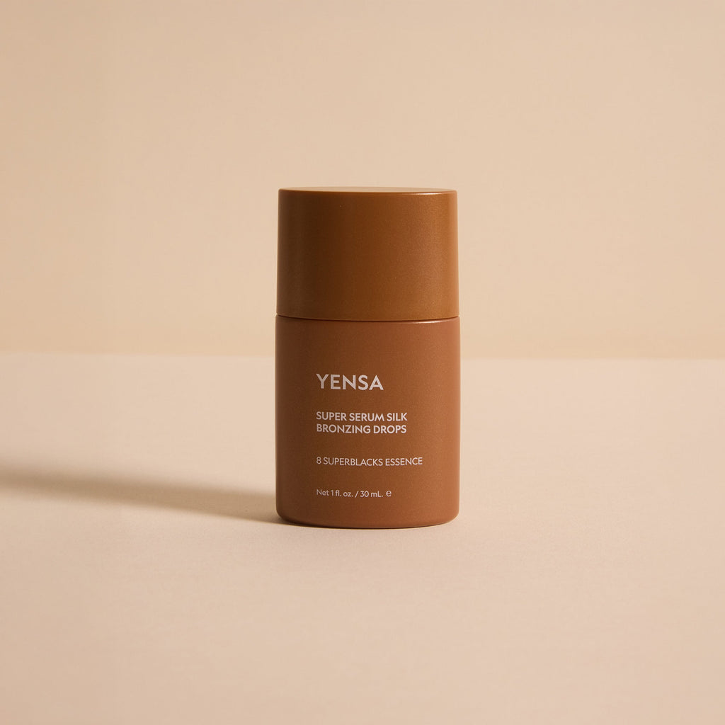YENSA Super Serum Silk Bronzing Drops bottle with a swatch of sheer golden bronzing serum on skin