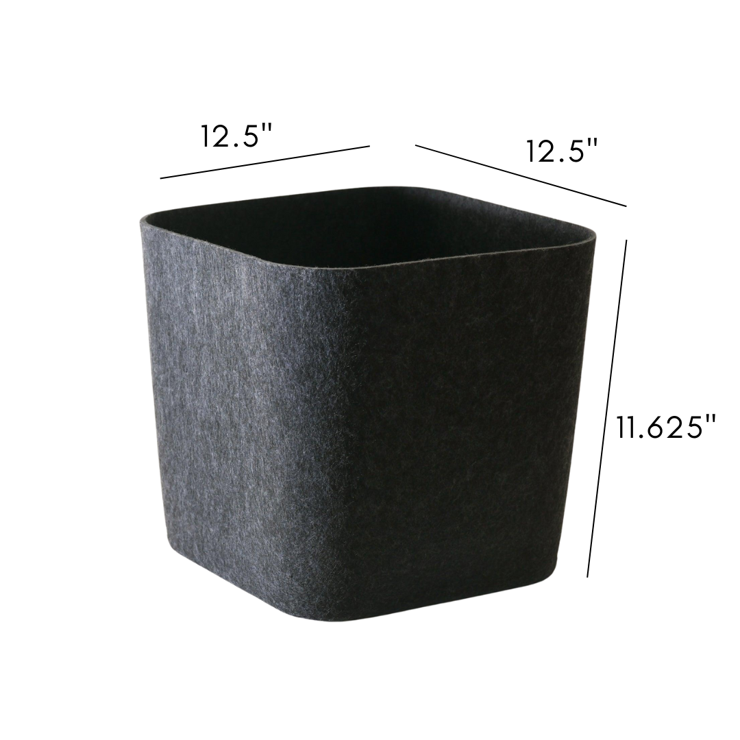 SortJoy Sculpted Storage Bin in Carbon colorway, structured shape on a shelf holding folded linens