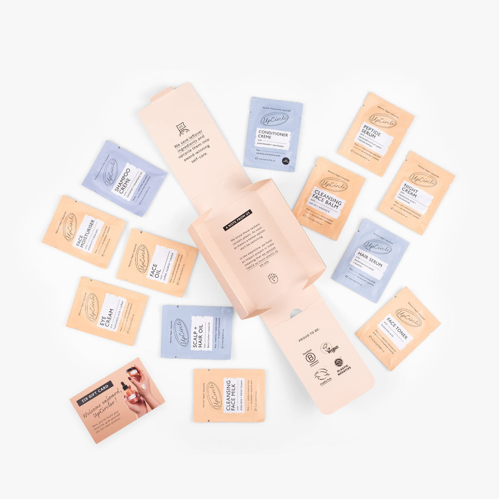 UpCircle Pamper + Gift skincare kit with sample-size face and hair care products and a $20 gift card