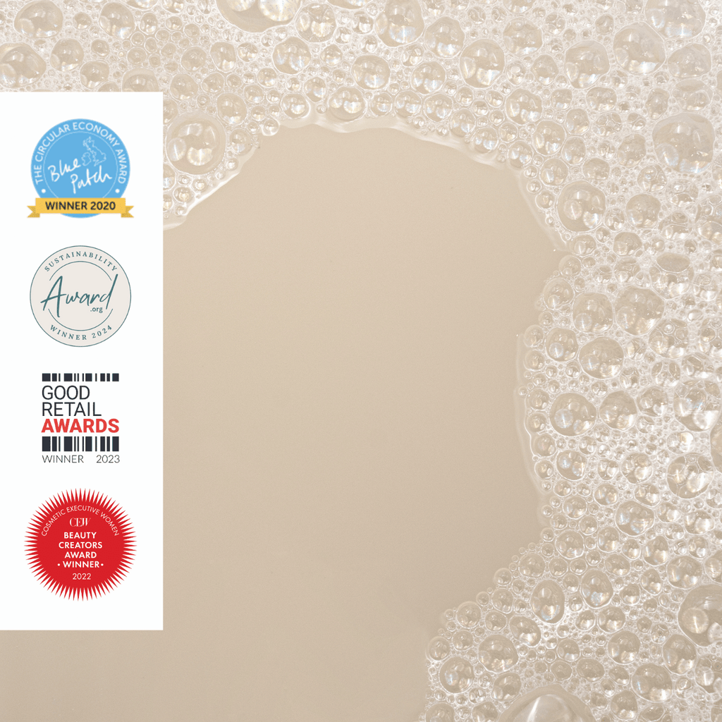 UpCircle Hyaluronic Acid and Chamomile Face Toner in a glass spray bottle with cardboard packaging on a clean surface