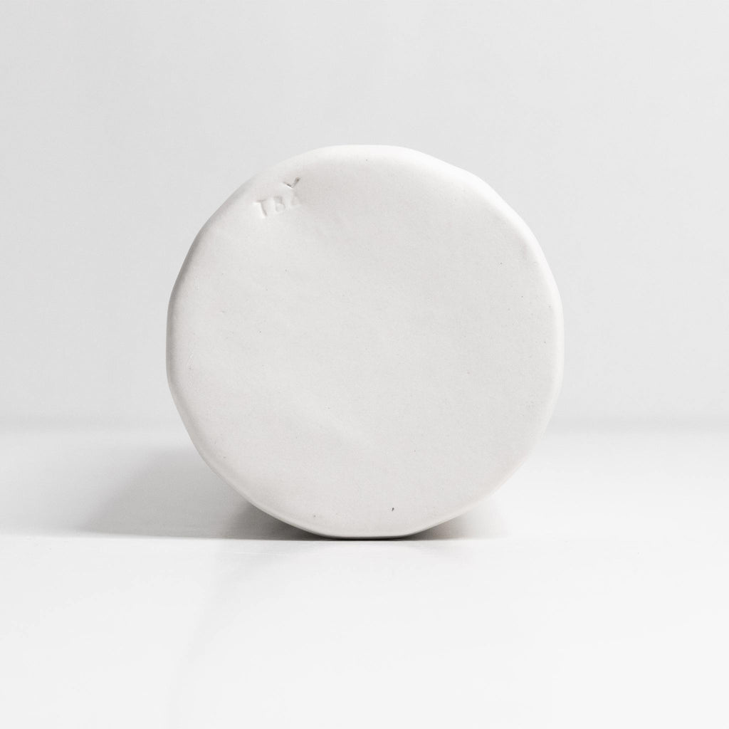 Elixir satin-glazed porcelain olive oil dispenser with drip-free pour spout on a kitchen countertop
