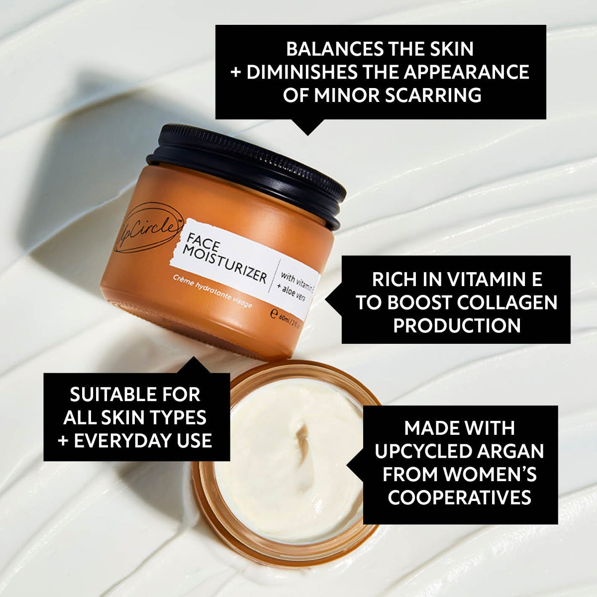 UpCircle Vitamin E Face Moisturizer in a glass jar with aluminum lid on a clean neutral background