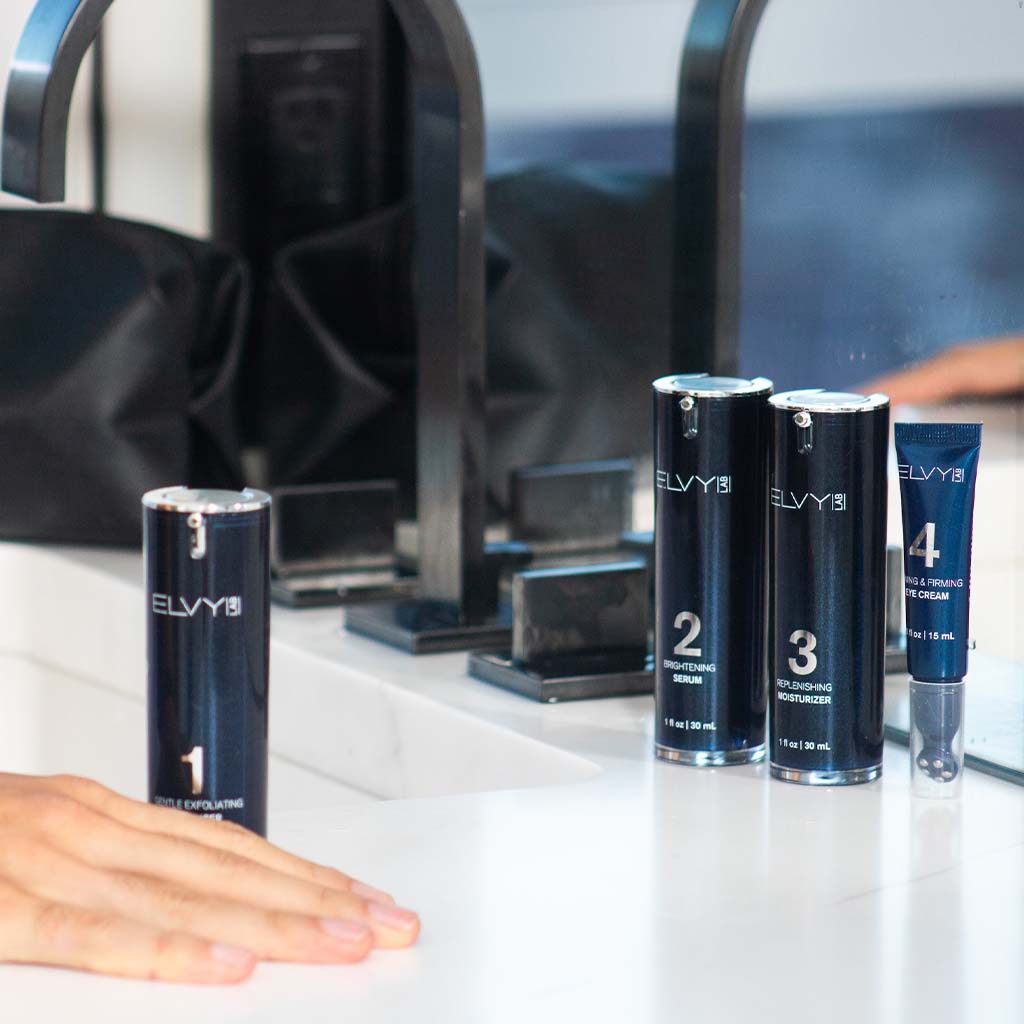 ELVY Lab The Regimen four-step men's daily skincare system kit with numbered products arranged in order