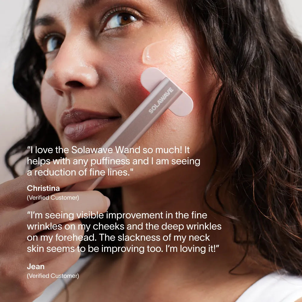 Solawave 4-in-1 red light therapy wand in rose gold next to LightBoost Activating Serum on a clean skincare flat lay