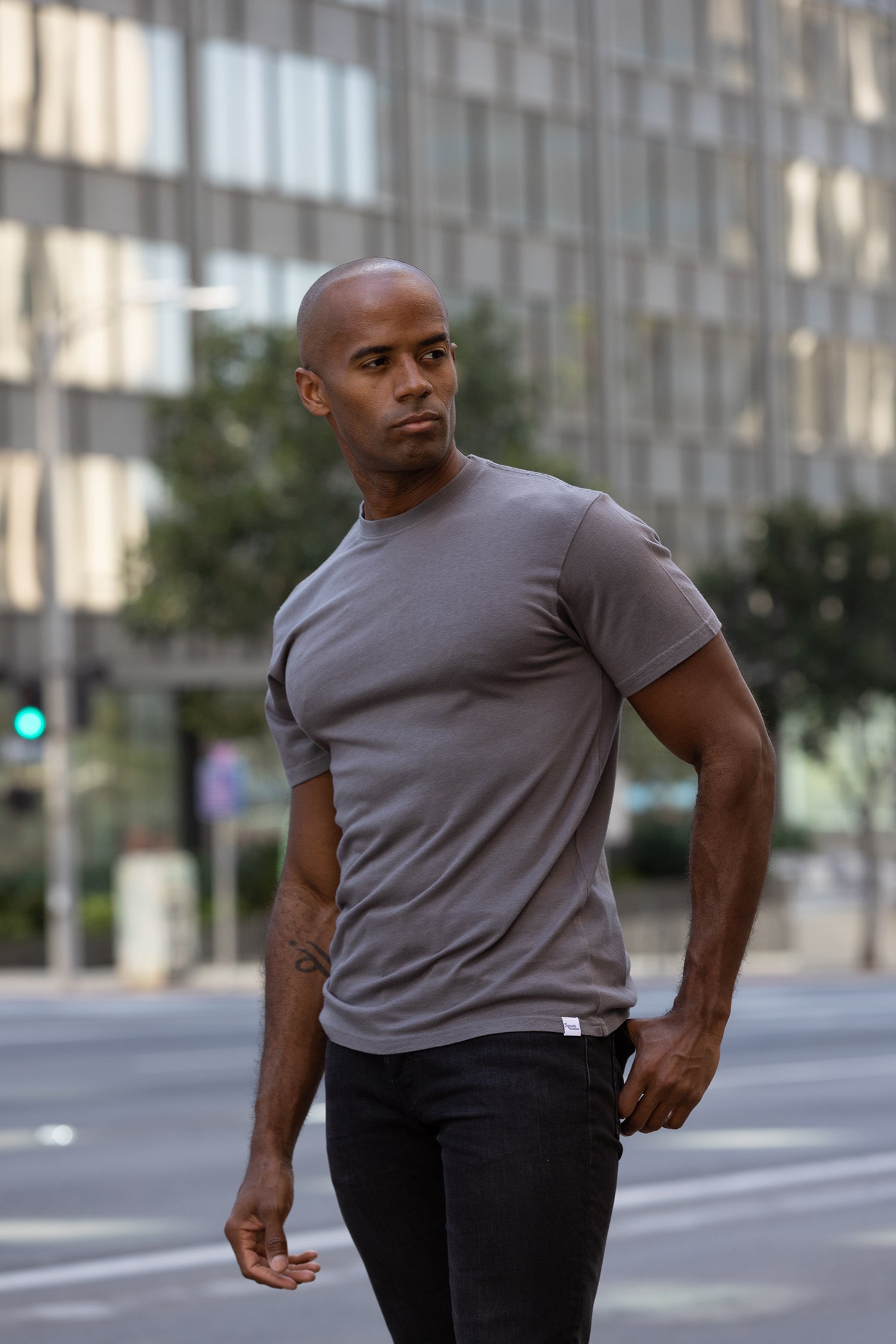 Men's bamboo viscose organic cotton crew neck t-shirt in charcoal grey, classic straight cut, laid flat on neutral background