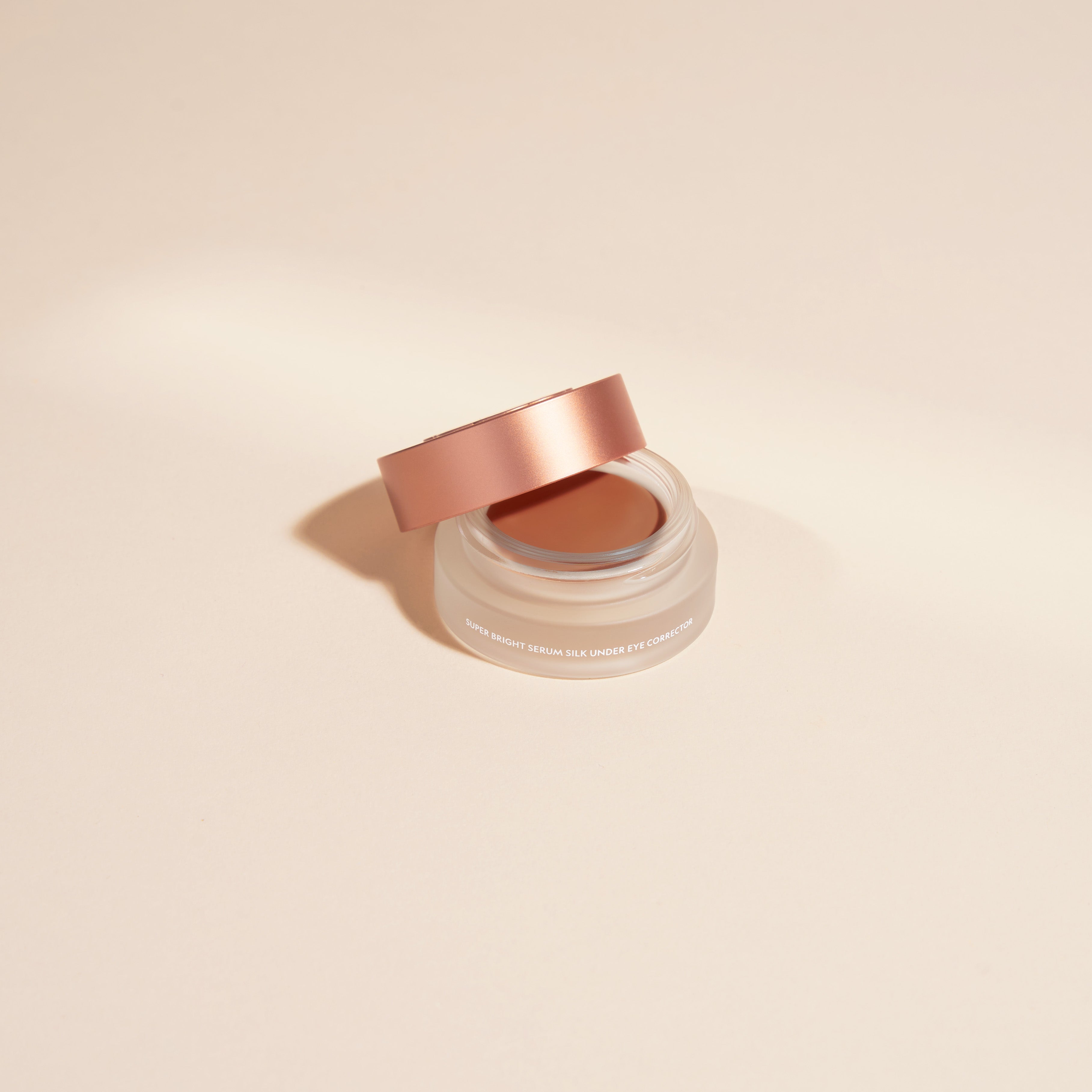 YENSA Super Bright Dark Circle Serum Peptide Corrector tube and applicator on a clean white surface