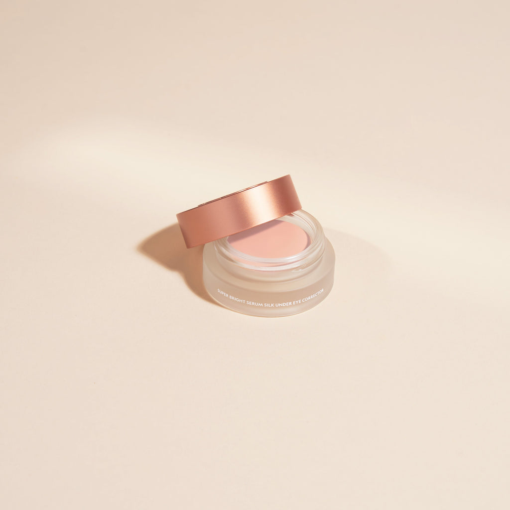 YENSA Super Bright Dark Circle Serum Peptide Corrector tube and applicator on a clean white surface