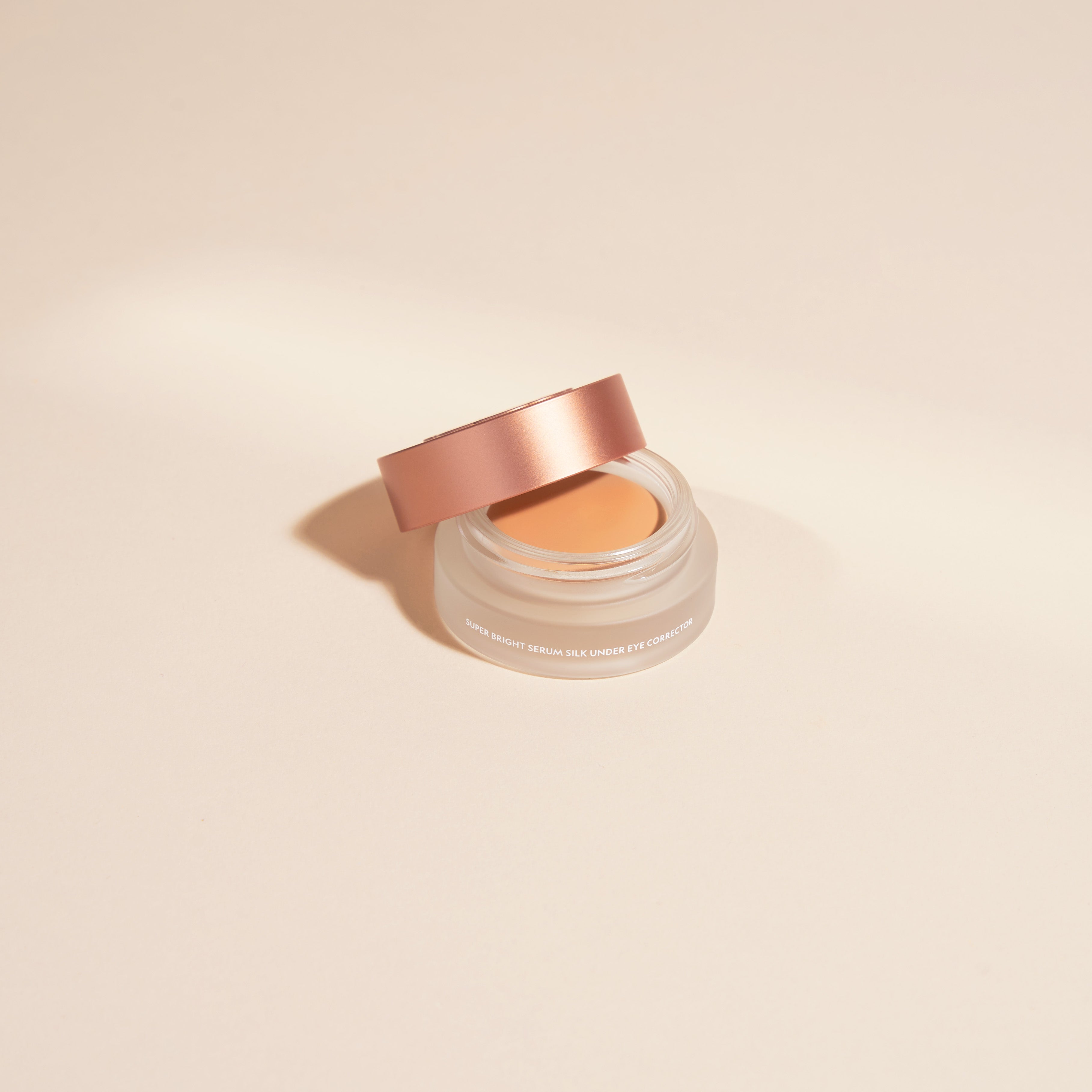 YENSA Super Bright Dark Circle Serum Peptide Corrector tube and applicator on a clean white surface