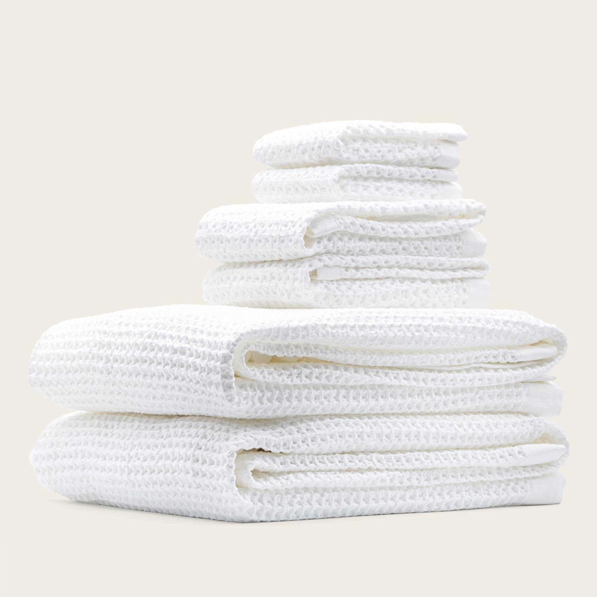 Folded Sedona Australian cotton waffle towels in a neutral colorway, showing dimensional open-weave texture