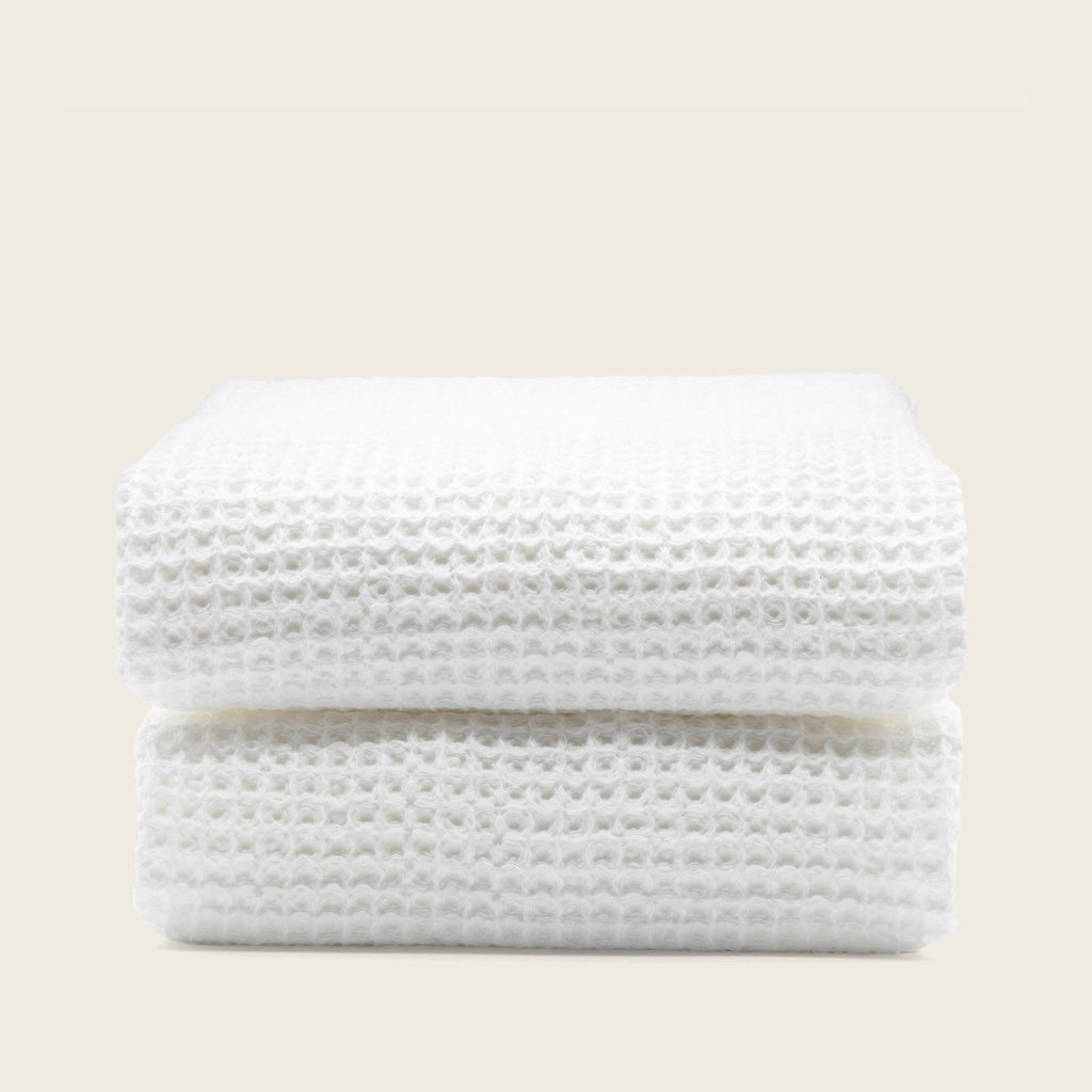 Folded Sedona Australian cotton waffle towels in a neutral colorway, showing dimensional open-weave texture