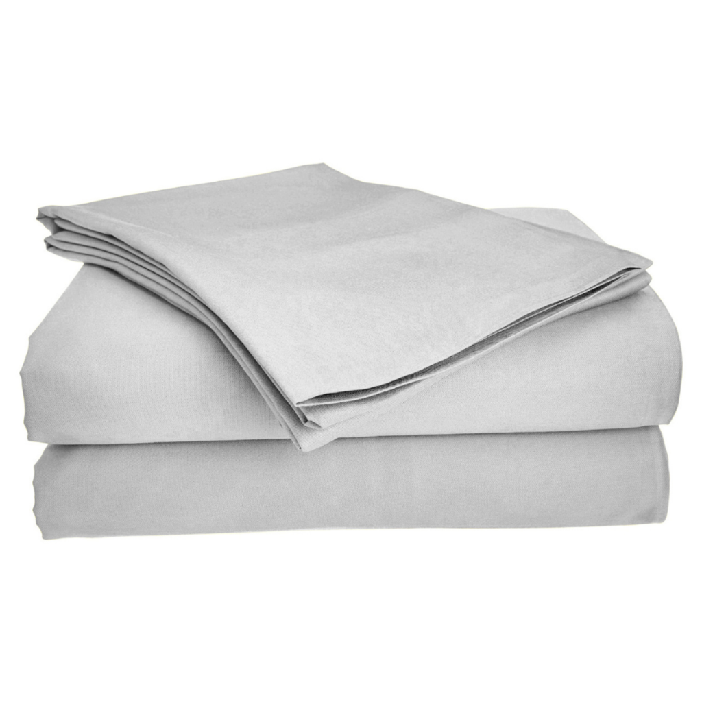 Four-piece bamboo viscose sheet set in neutral tone draped over a neatly made bed, showing silky smooth fabric texture
