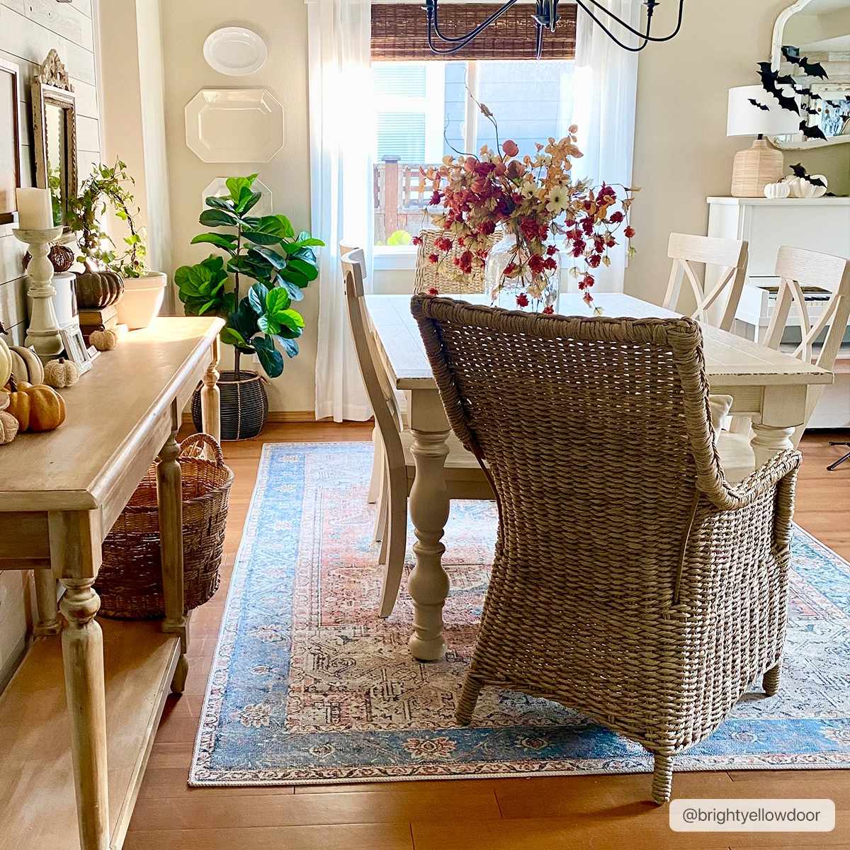 Rosman distressed flat weave area rug in warm red, blue, and earthy tones with vintage-inspired pattern
