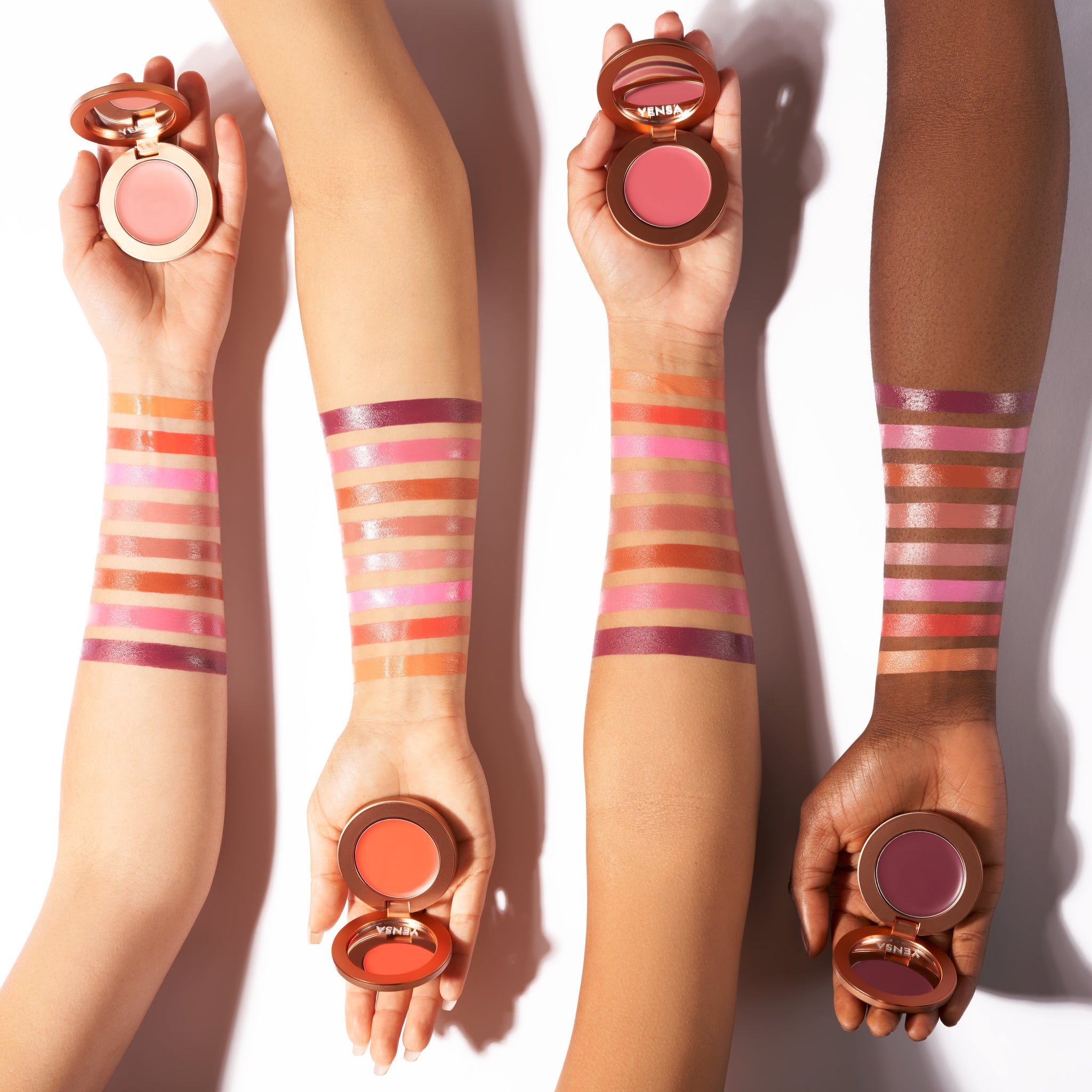 Close-up of buildable cream blush compact with a soft rosy swatch on fair skin showing a dewy, natural flush