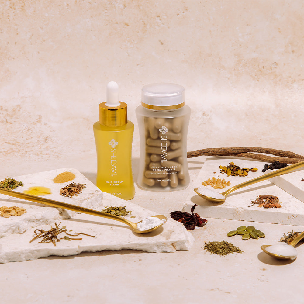 Shedavi Iconic Hair Growth Duo featuring the Hair Skin and Nails Herbal Vitamin bottle and Hair and Scalp Elixir dropper bottle on a neutral background