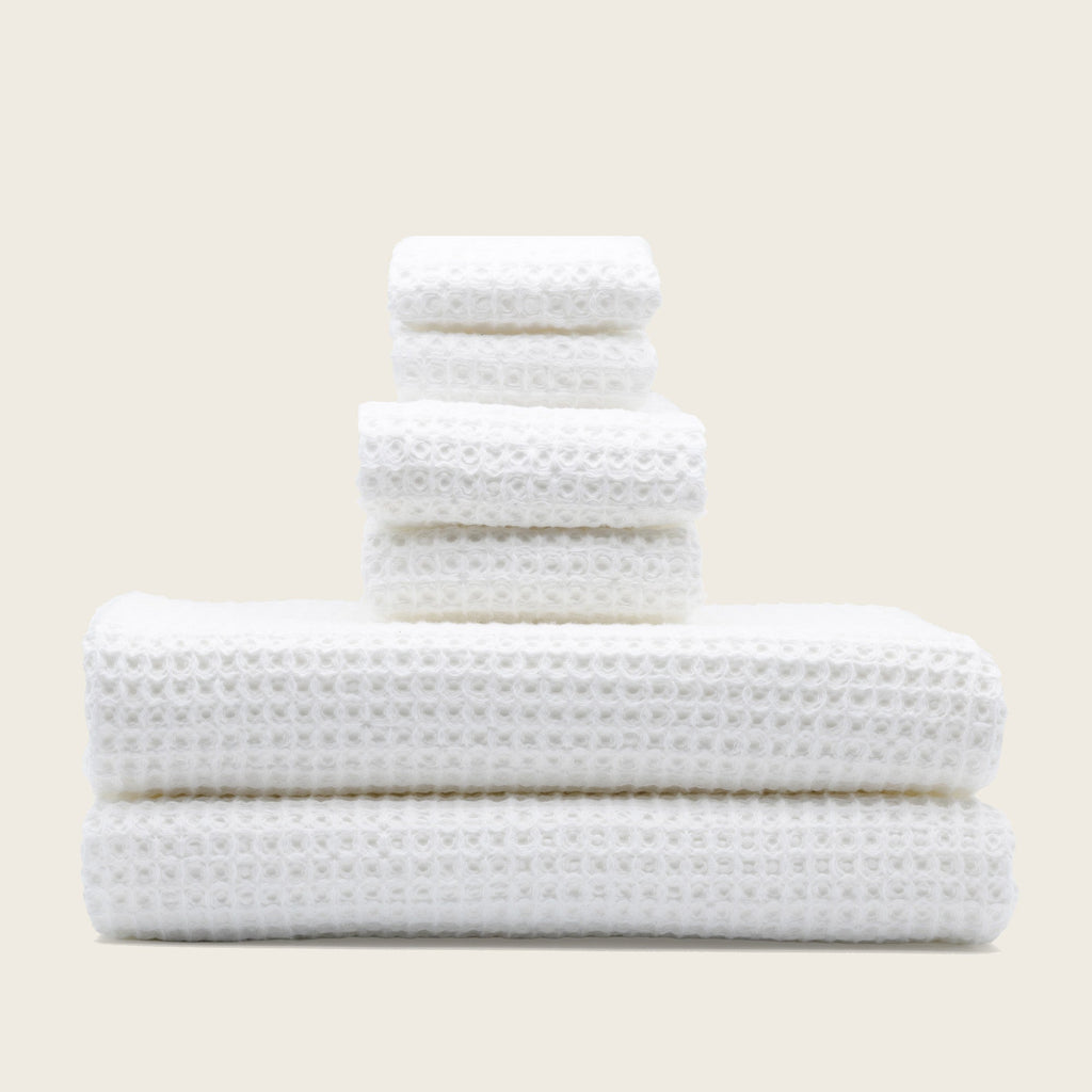 Folded Sedona Australian cotton waffle towels in a neutral colorway, showing dimensional open-weave texture
