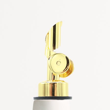 Elixir satin-glazed porcelain olive oil dispenser with drip-free pour spout on a kitchen countertop