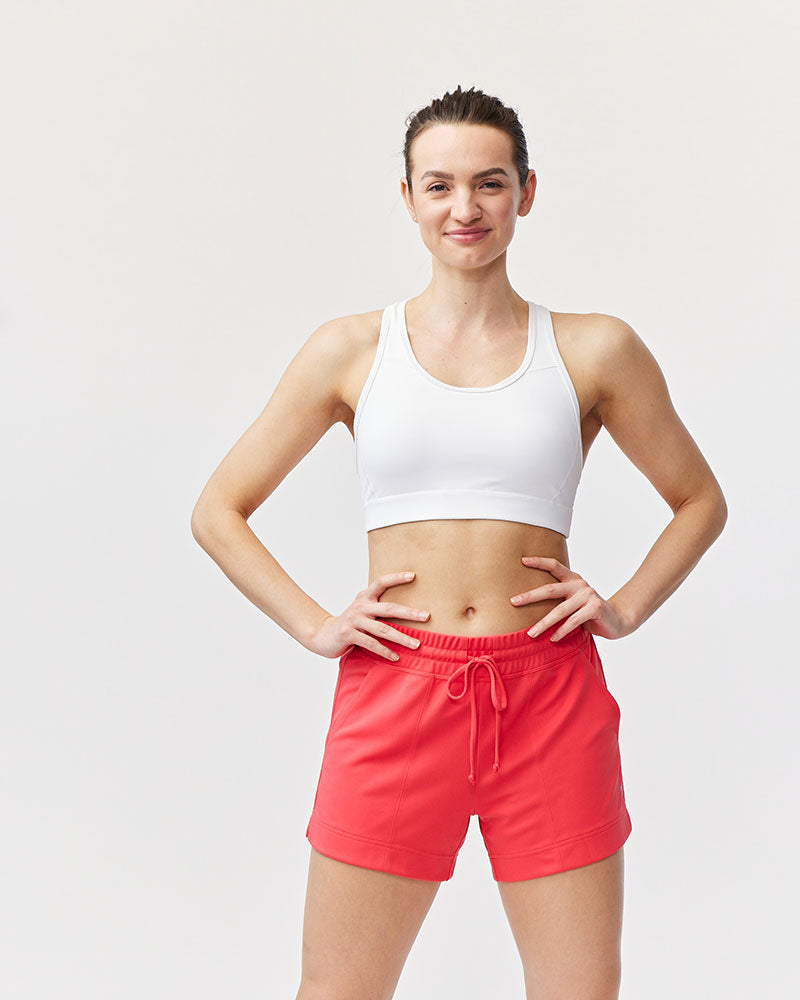 Front view of the 99'er padded sports bra in a solid colorway showing the crossover hexagonal back detail and sleek silhouette