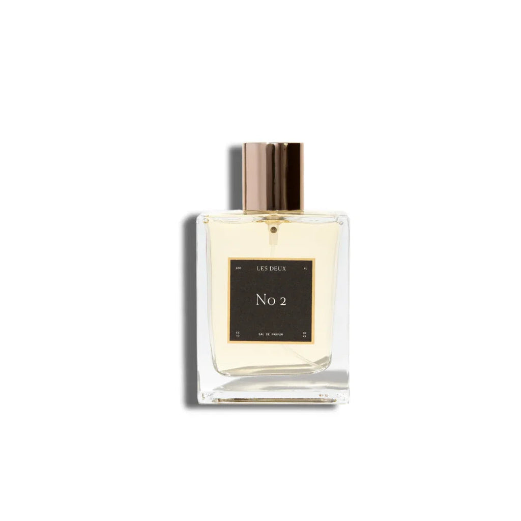 Les Deux Fragrances No. 2 Peau d'Or perfume bottle with amber and gold tones on a neutral background