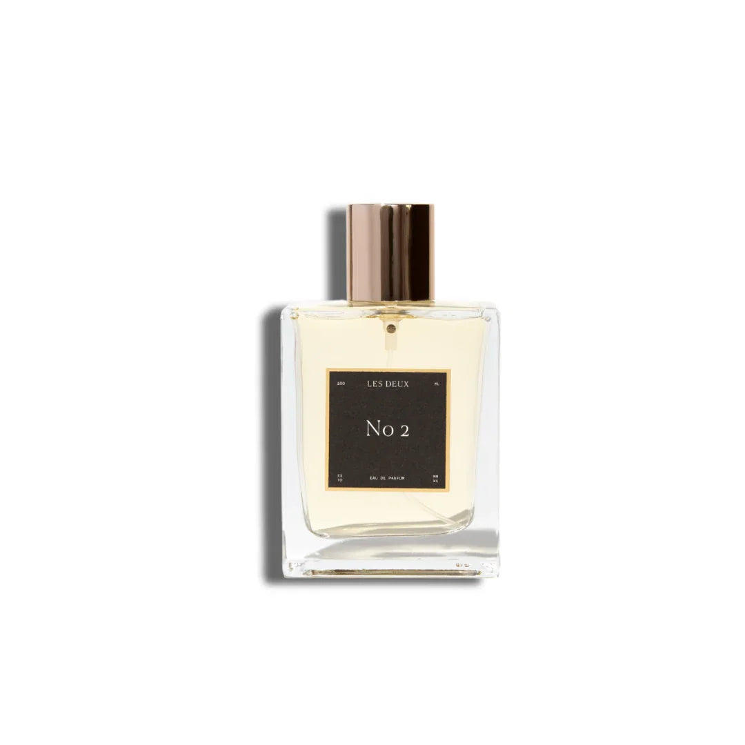 Les Deux Fragrances No. 2 Peau d'Or perfume bottle with amber and gold tones on a neutral background