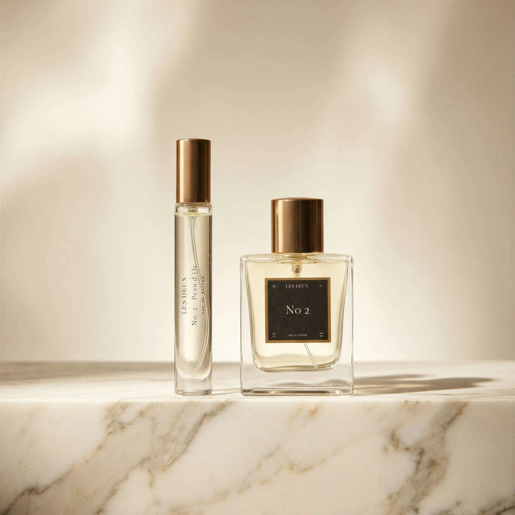 Les Deux Fragrances No. 2 Peau d'Or perfume bottle with amber and gold tones on a neutral background
