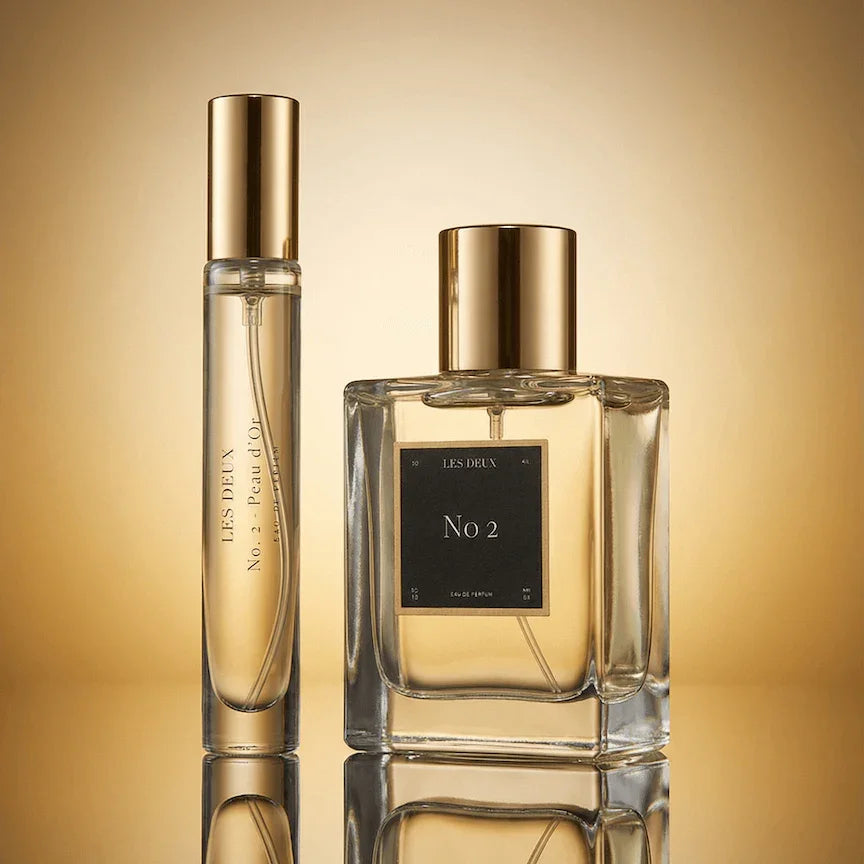 Les Deux Fragrances No. 2 Peau d'Or perfume bottle with amber and gold tones on a neutral background